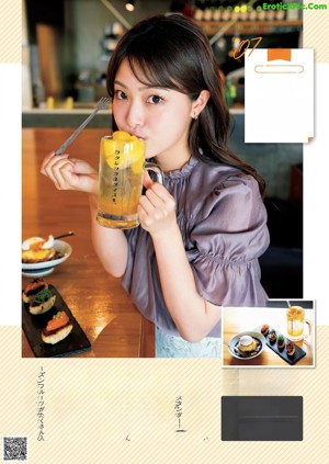 A woman sitting at a table with a bowl of food.