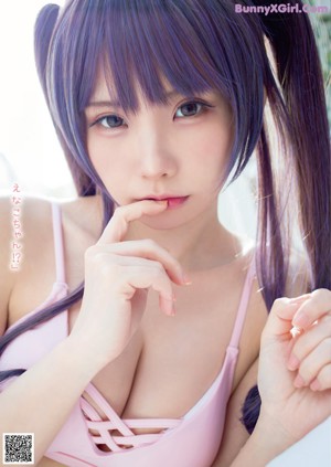 A woman in a blue bra and panties posing for a picture.
