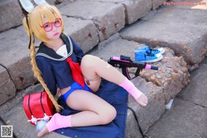 A woman in a sailor outfit with long blonde hair and bunny ears.